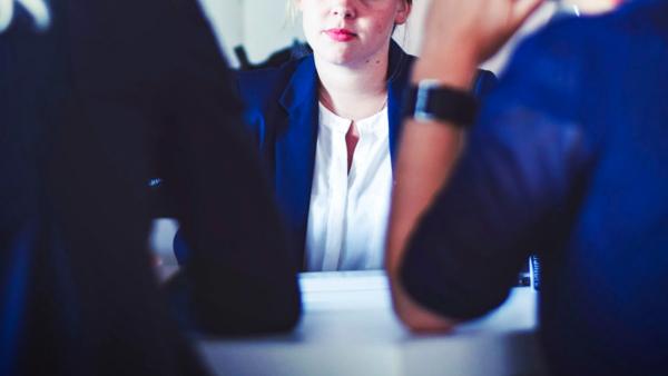 Woman waiting for moment to speak at a meeting